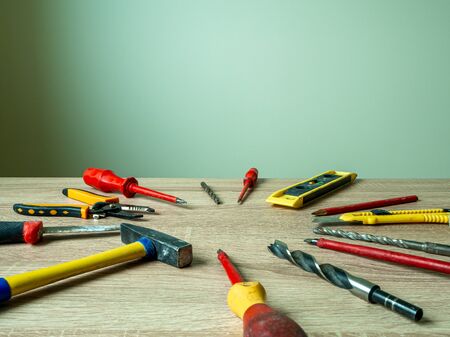 Engineer desk with a lot of things about engineering tools on office desk workplace. Selective Focus. Set of old used work tools on old wooden table. Building and treatment tools. Copy spaceの写真素材