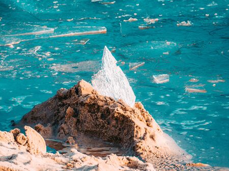 Close up of Ice on the beach. Beach on Eastern seaside of Europe in Estonia with ice chunks. Copy...