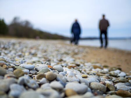 Selective focus. Coast. Spa stones, sea beach. Coast. many Stones on the beach and sea water in...