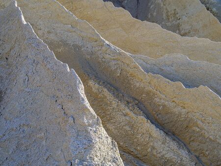 Abandoned Quarry Of Rummu, Estonia. Scenic View Of Land. Mountain of white sand.and stones. Panoramic View. The erosion of limestone quarry. Sandy hill.の写真素材