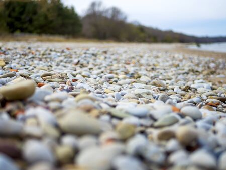 Selective focus. Coast. Spa stones, sea beach. Coast. many Stones on the beach and sea water in...