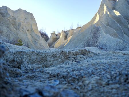 Abandoned Quarry Of Rummu, Estonia. Scenic View Of Land. Mountain of white sand and stones. Panoramic View. The erosion of limestone quarry. Sandy hill. Beautiful Texture of surface. Earth, explore.の写真素材