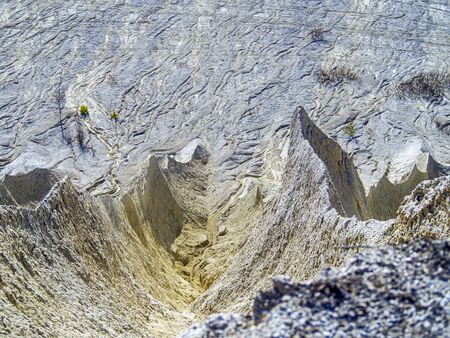 Abandoned Quarry Of Rummu, Estonia. Scenic View Of Land. Mountain of white sand.and stones. Panoramic View. The erosion of limestone quarry. Sandy hill.の写真素材