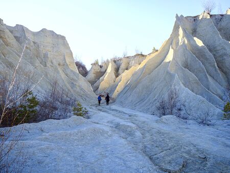 Abandoned Quarry Of Rummu, Estonia. Scenic View Of Land. Mountain of white sand and stones. Panoramic View. The erosion of limestone quarry. Sandy hill. Beautiful Texture of surface. Earth, explore.の写真素材