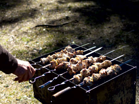 Red hot burning charcoal preparing for grilling, barbecue grill, BBQ. Forest on the background. Waiting for the placement of your food. Close up. vacation conceptの写真素材