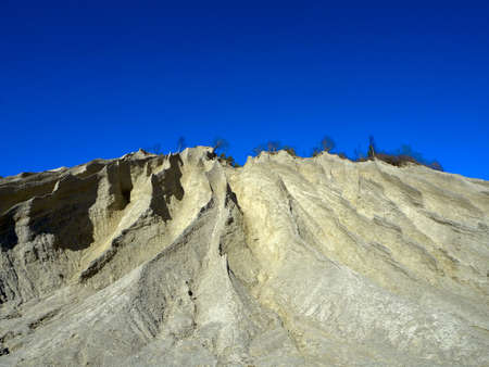 Abandoned Quarry Of Rummu, Estonia. Scenic View Of Land. Mountain of white sand and stones. Panoramic View. The erosion of limestone quarry. Sandy hill. Beautiful Texture of surface. Earth, explore. の写真素材