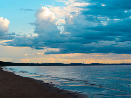 The Baltic Sea at sunset, stormy dramatic clouds. storm Passing over Sea, Sunset and dark clouds after storm. The Vacation, summer conceptの写真素材
