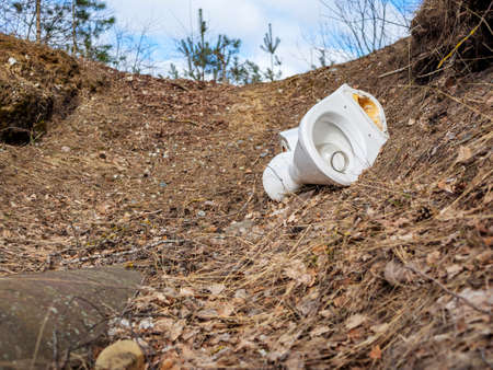 Toilet Litter. Pollution of the forest by household rubbish on nature. A pile of garbage. Broken...