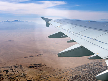 Aerial view above the clouds and sky, Inspiration concept. Travel freedom by air. Flight, view from the airplane to tropical sea with corals. Turbo-jet aircraft engine, transport 4k.の写真素材