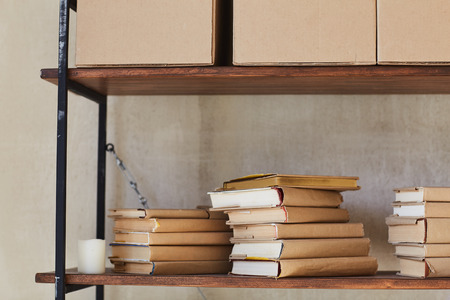Shelf with boxes and books. Metal shelfの写真素材