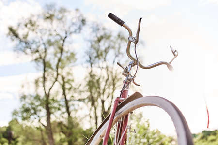 Old red bike in the meadow.  Sunnyの写真素材