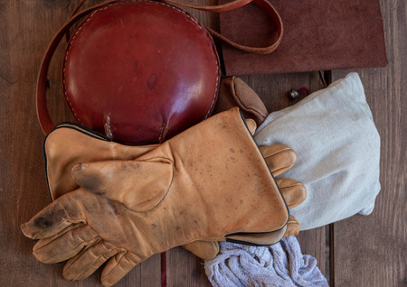Vintage gloves and red handbag on the table.