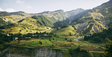 Caucasian Mountain in summer. Cross Pass in Georgia. Gudauri District. Source of Aragvi River. View from Soviet Monument to Russian Georgian Arch of Friendship of Peoples.の写真素材
