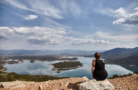 Slansky lake. The young girl looks at the lake. A woman admires the beauty of Montenegro. Montenegro, summer.の写真素材