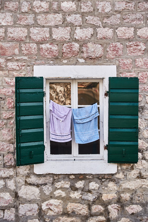 Drying clothes. Open window. The Town Of Kotor. Montenegro. Summertimeの写真素材