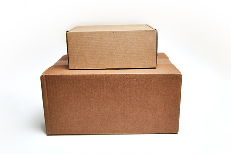 close up of a stack of cardboard boxes on white background.の写真素材
