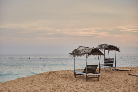 two sun loungers. Midigama Beach. Sunset in the Indian ocean. Midigama, Sri Lanka.の写真素材