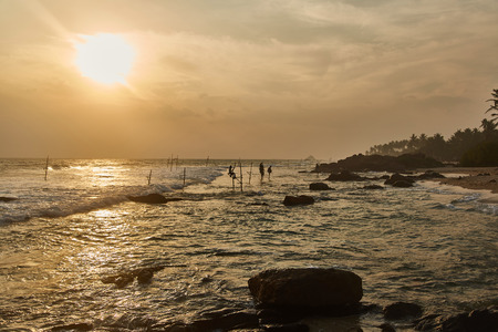 Fishermen in Sri Lanka fishing at sunset. Indian Ocean. Sri-lankaの写真素材
