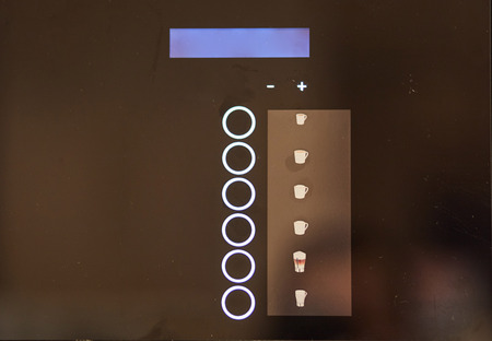 Touch buttons on the vending machine. Coffee machine close up.