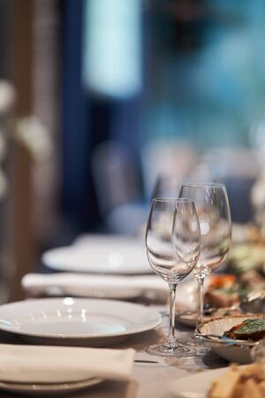empty champagne glasses. Table set for an event party or wedding reception. Banquet table designの写真素材