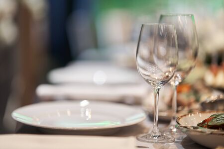 empty champagne glasses. Table set for an event party or wedding reception. Banquet table design