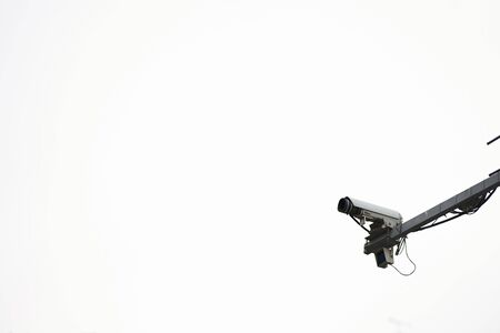 Traffic control camera on the road in a big city. Camera sky background