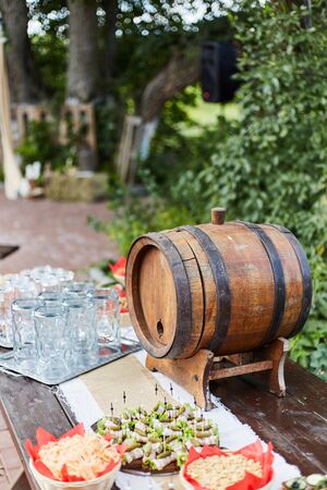 Wooden barrel for draft drinks close up.