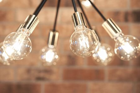 Ceiling chandelier from a variety of lamps. modern design, loft, unusual lamp. Design indoor chandelier.の写真素材