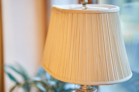 Old antique lamp in the interior. Lampshade of an old lamp.