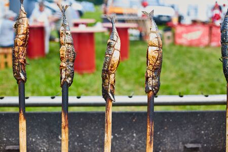 Smoked dried fish close up. Agricultural Exhibition.の写真素材