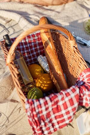 Basket with food for a picnic. Baguette and wine.の写真素材