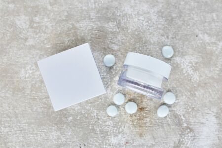 Blank cosmetic containers on grey background. Skincare cosmetic products. Mockupの写真素材