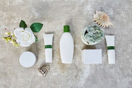 Blank cosmetic containers on grey background. Skincare cosmetic products. Mockupの写真素材