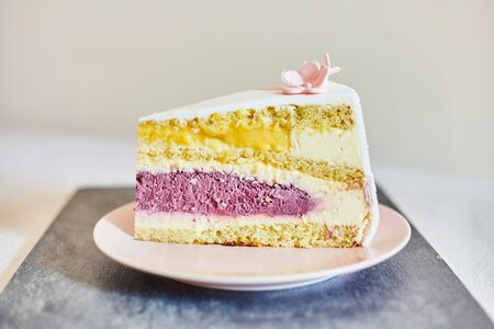 Sweet piece of cake on a plate. A piece of wedding cake.の写真素材