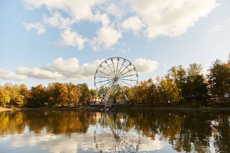 Ferris wheel. Amusement park. Ferris wheel booths on sky background.の写真素材