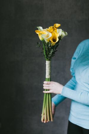 Beautiful bouquet of flowers in the hands of a woman.の写真素材