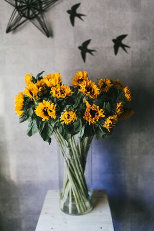 Bouquet of yellow small sunflowers close up.の写真素材