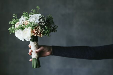Beautiful bouquet of flowers in the hands of a woman.の写真素材