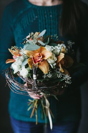 Beautiful bouquet of flowers in the hands of a woman.の写真素材