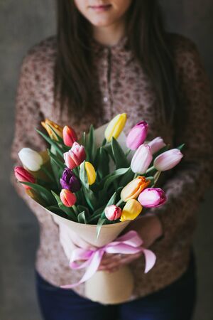 Beautiful bouquet of flowers in the hands of a woman.の写真素材
