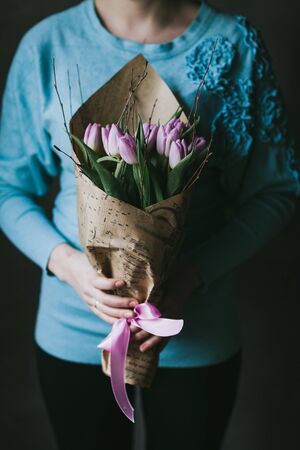 Beautiful bouquet of flowers in the hands of a woman.の写真素材