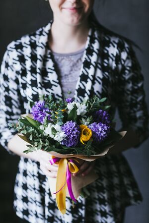 Beautiful bouquet of flowers in the hands of a woman.の写真素材