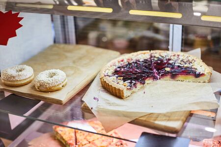 Berry tart on a pastry shop window.