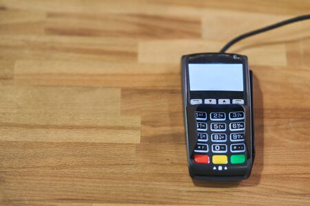 Bank terminal for payment in a cafe. Contactless payment terminal.