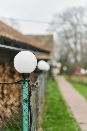 White lamp on the fence in the village.の写真素材