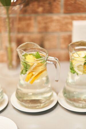 Fresh mojito with mint and lemon in a decanter.