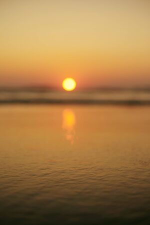 India, North Goa. Beautiful Sunset at Arambol Beach. Blurred image.