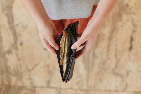 Indian rupees in a wallet. The wallet in the hands of a girl with Indian rupees.