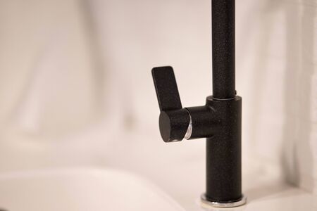 Modern black faucet. Close-up. Bathroom interior details. Washbasinの写真素材