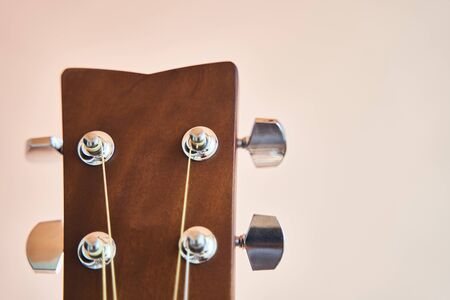 Acoustic guitar headboard with pegs. Guitar fretboard.の写真素材